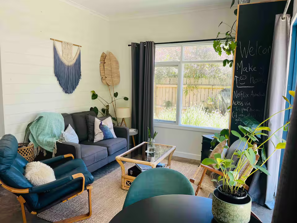 Cozy living room with fireplace inside The Tin Pod